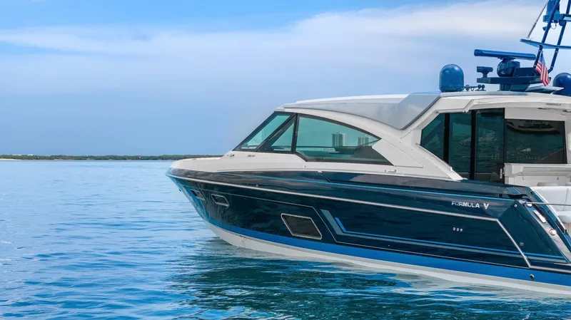 Slide: The Image of 2022 Formula 500 Super Sport Crossover yacht on calm blue water. - 7
