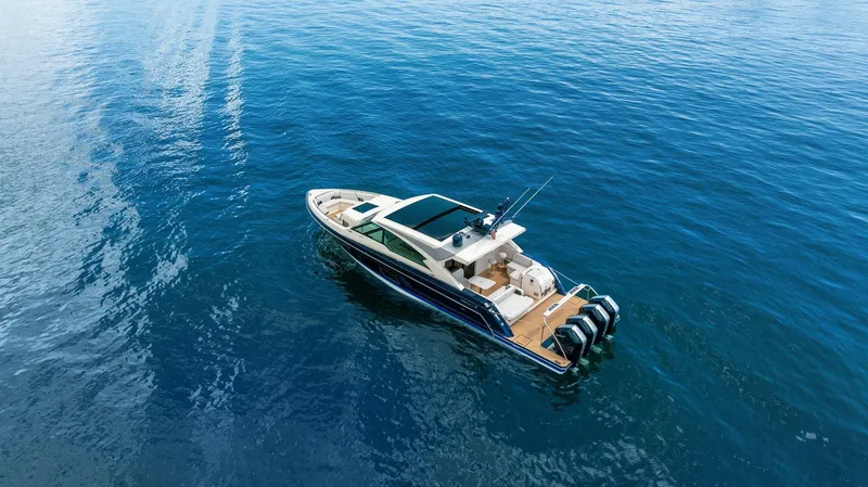 Slide: The Image of 2022 Formula 500 Super Sport Crossover cruising on open blue water. - 8