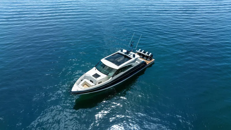 Slide: The Image of 2022 Formula 500 Super Sport Crossover yacht on calm blue water. - 9