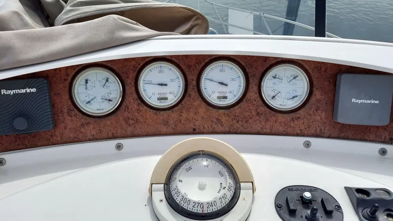 Slide: The Image of Dashboard of 2005 Silverton 43 Motor Yacht with gauges and compass. - 10