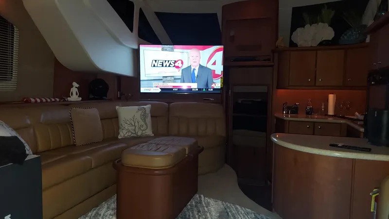 Slide: The Image of Interior of 2005 Silverton 43 Motor Yacht with TV and cozy seating area. - 12