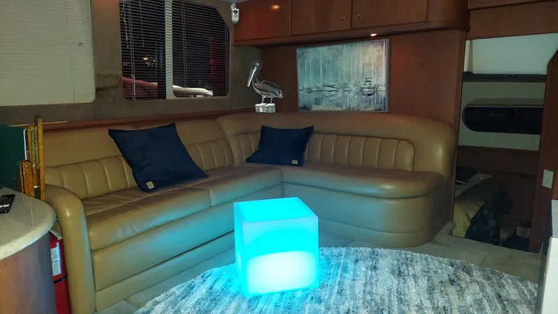 Slide: The Image of Luxurious interior of 2005 Silverton 43 Motor Yacht with leather seating and ambient lighting. - 13