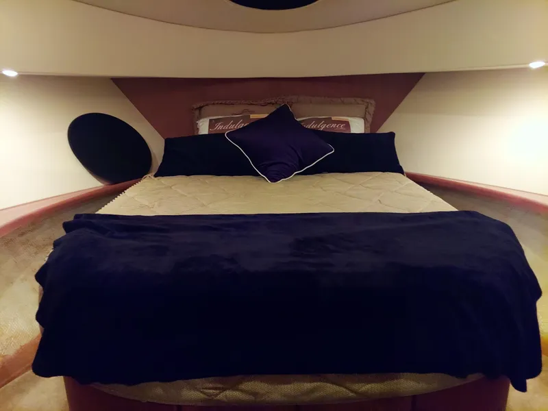 Slide: The Image of Luxurious bedroom interior of 2005 Silverton 43 Motor Yacht with elegant bedding. - 18