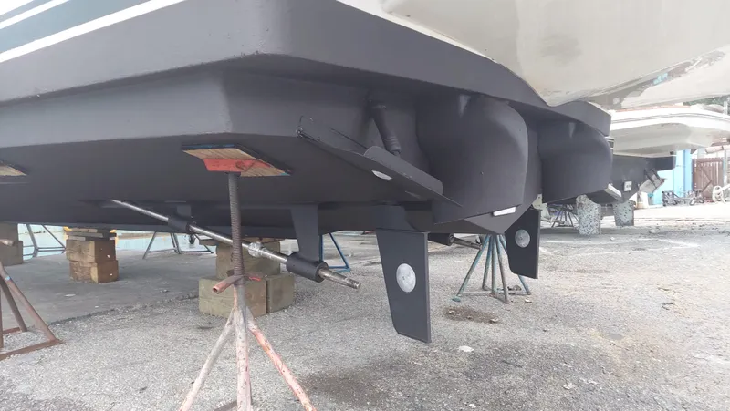 Slide: The Image of 2005 Silverton 43 Motor Yacht hull on stands, showcasing underside details. - 4