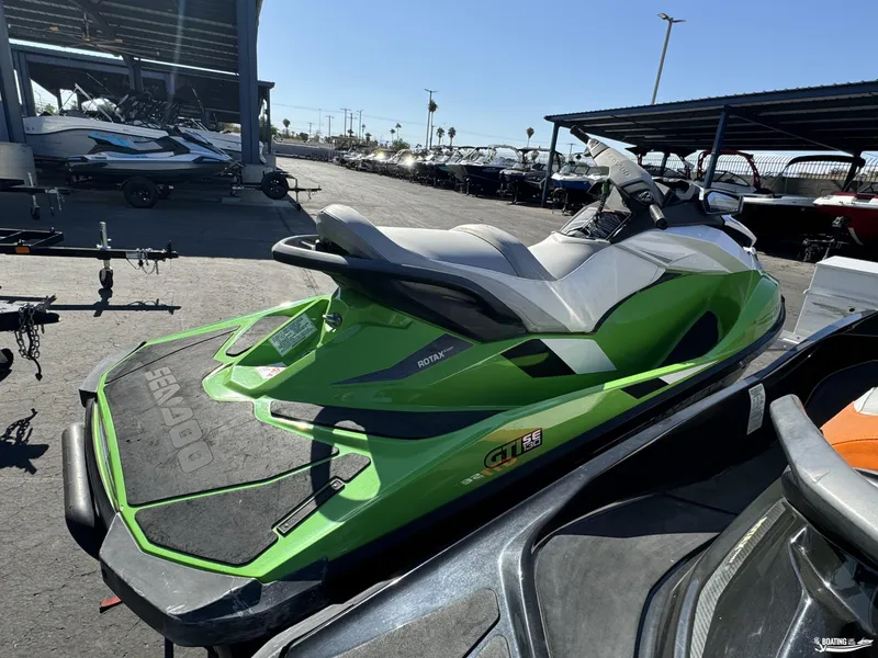 Slide: The Image of 2014 Sea-Doo GTI 130 SE/GTI 155 SE jet ski in vibrant green, parked outdoors. - 3