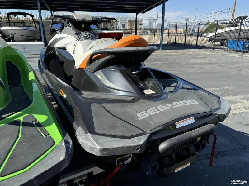 Slide: The Image of 2014 Sea-Doo GTI 130 SE/GTI 155 SE jet ski parked outdoors. - 4