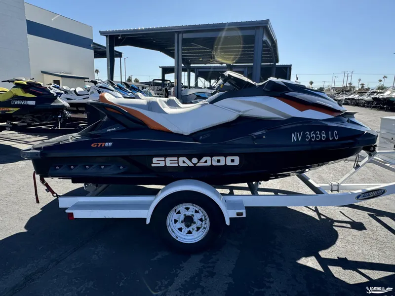 Slide: The Image of 2014 Sea-Doo GTI 130 SE/GTI 155 SE jet ski on trailer in parking lot. - 6