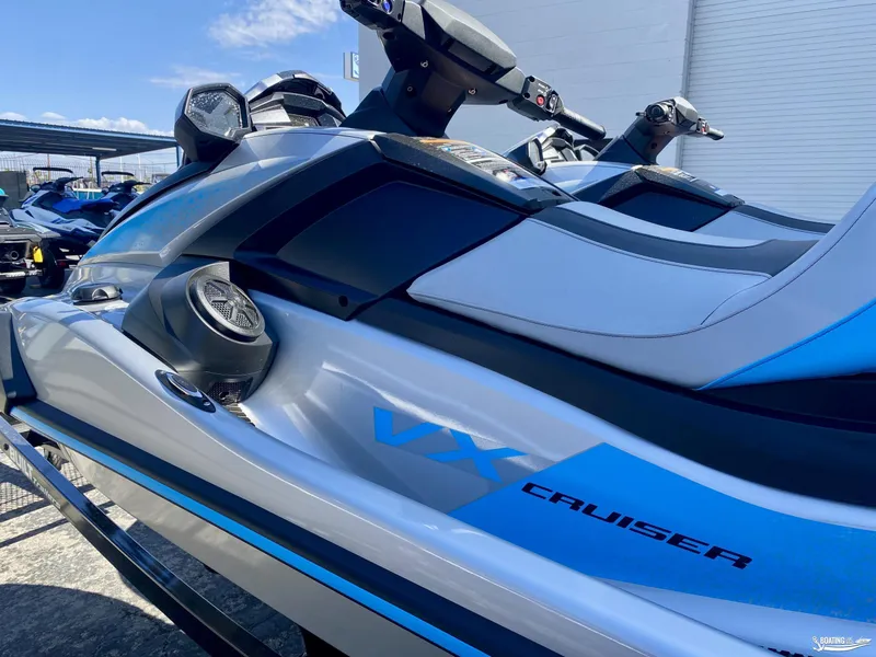 Slide: The Image of 2024 Yamaha WaveRunner VX Cruiser with Audio, sleek design, parked outdoors. - 2