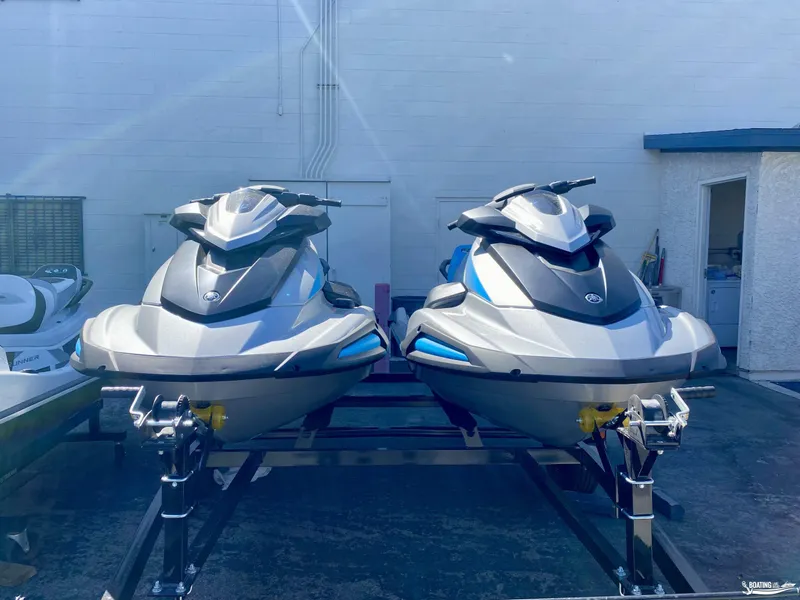 Slide: The Image of 2024 Yamaha WaveRunner VX Cruiser w/Audio, silver and blue, on trailer, outdoor setting. - 4