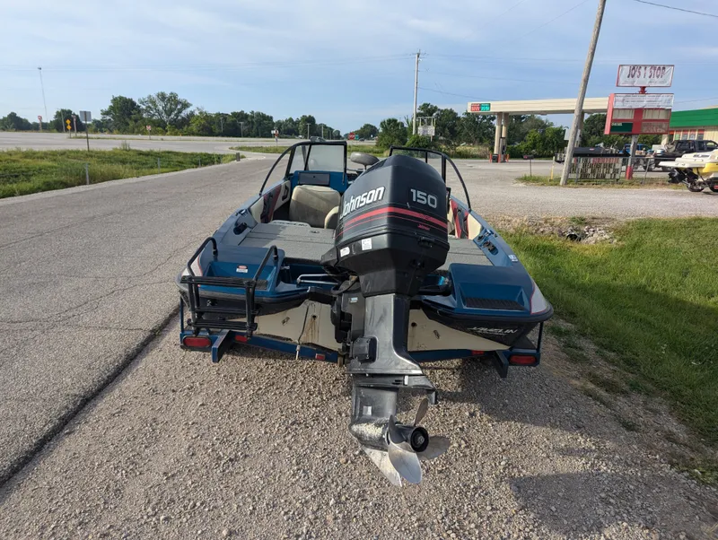 Slide: The Image of 1996 Javelin 379 F/S boat with Johnson 150 outboard motor on roadside. - 5