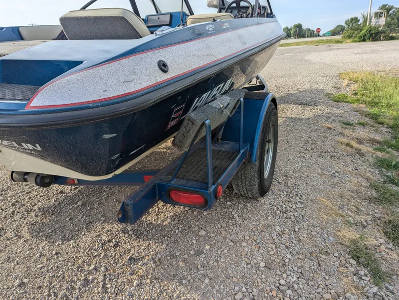 Slide: The Image of 1996 Javelin 379 F/S boat on trailer, parked on gravel road. - 6