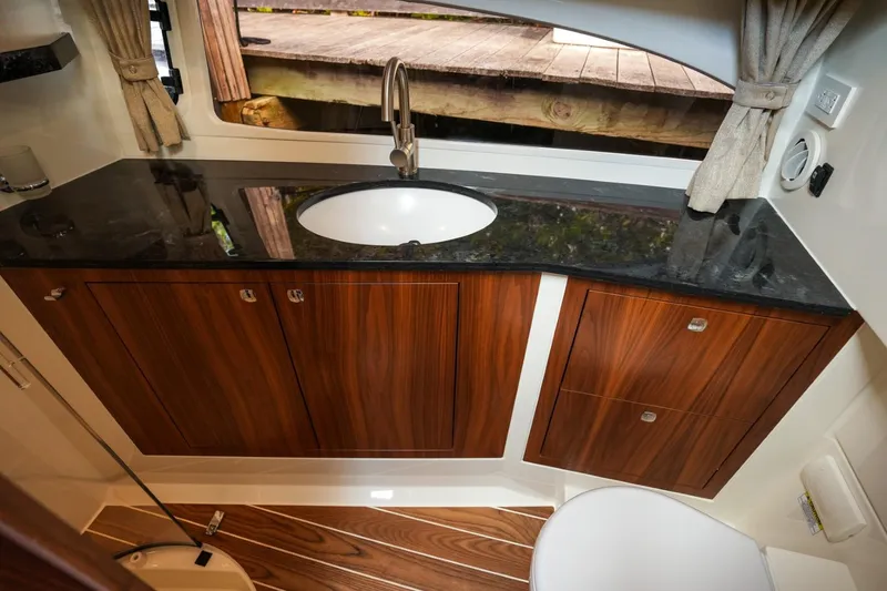 Slide: The Image of Luxury bathroom interior of 2025 Marex 330 Scandinavia yacht with wood cabinets and modern sink. - 35