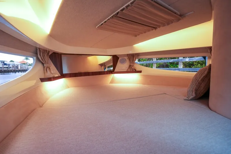 Slide: The Image of 2025 Marex 330 Scandinavia interior cabin with ambient lighting and cozy design. - 37