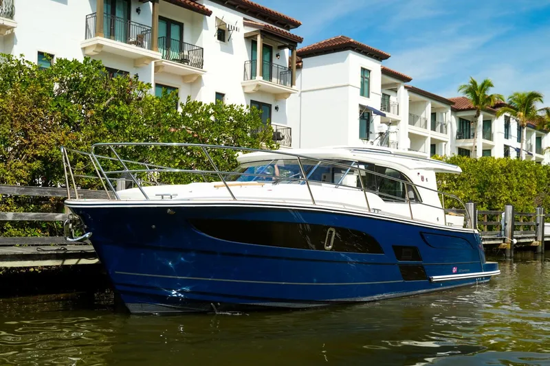 Slide: The Image of 2025 Marex 330 Scandinavia yacht docked near waterfront buildings. - 39