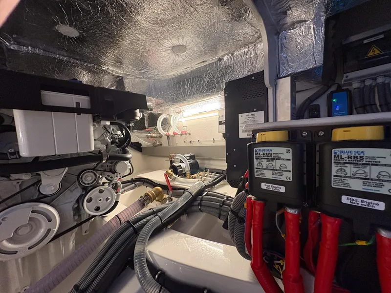Slide: The Image of Engine room of 2025 Marex 330 Scandinavia, showcasing mechanical components and wiring. - 46