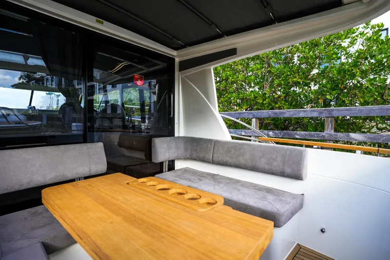 Slide: The Image of 2025 Marex 330 Scandinavia yacht interior with seating and wooden table. - 17