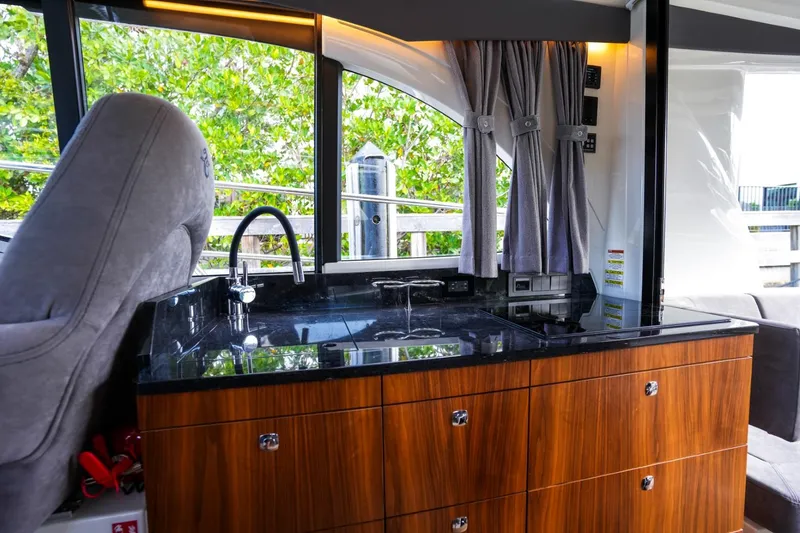 Slide: The Image of 2025 Marex 330 Scandinavia yacht interior with sleek kitchen and modern design. - 20