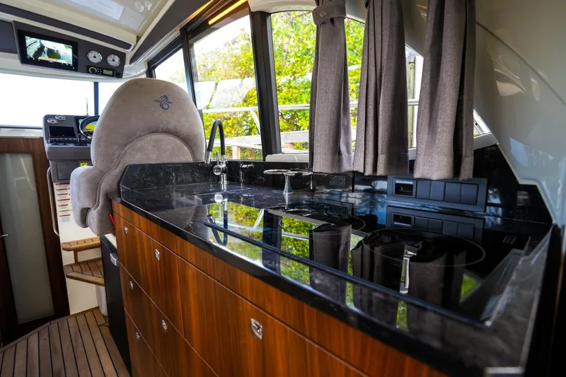 Slide: The Image of Interior of 2025 Marex 330 Scandinavia yacht with sleek kitchen and modern helm. - 23