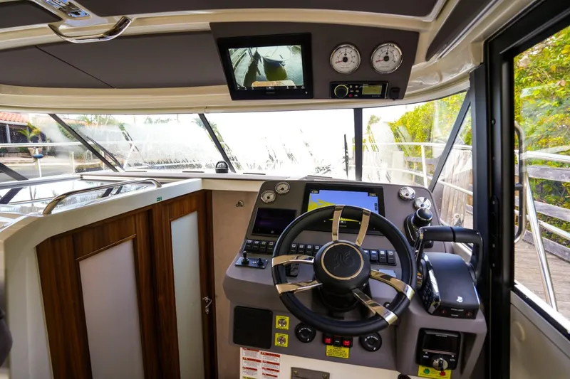 Slide: The Image of Helm of 2025 Marex 330 Scandinavia boat with modern navigation equipment and controls. - 27