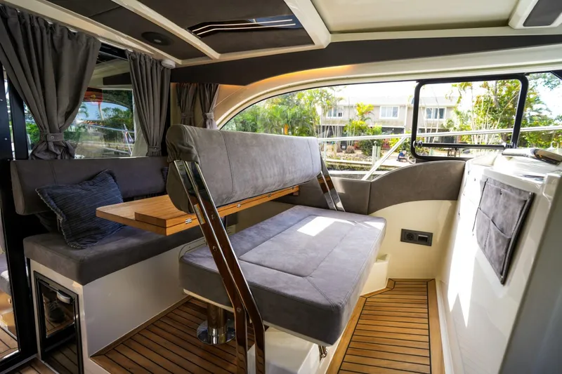 Slide: The Image of Interior of 2025 Marex 330 Scandinavia yacht with modern seating and wooden flooring. - 30