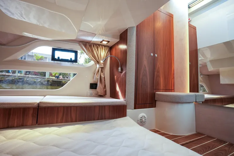 Slide: The Image of Luxurious interior of 2025 Marex 330 Scandinavia yacht with wood finishes and cozy bedding. - 33