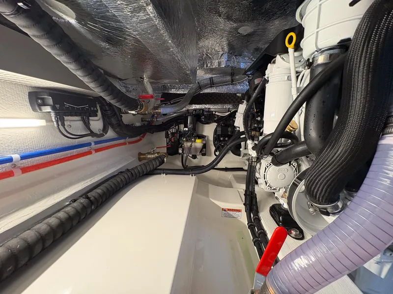 Slide: The Image of Engine room of 2025 Marex 330 Scandinavia, showcasing complex wiring and mechanical components. - 47