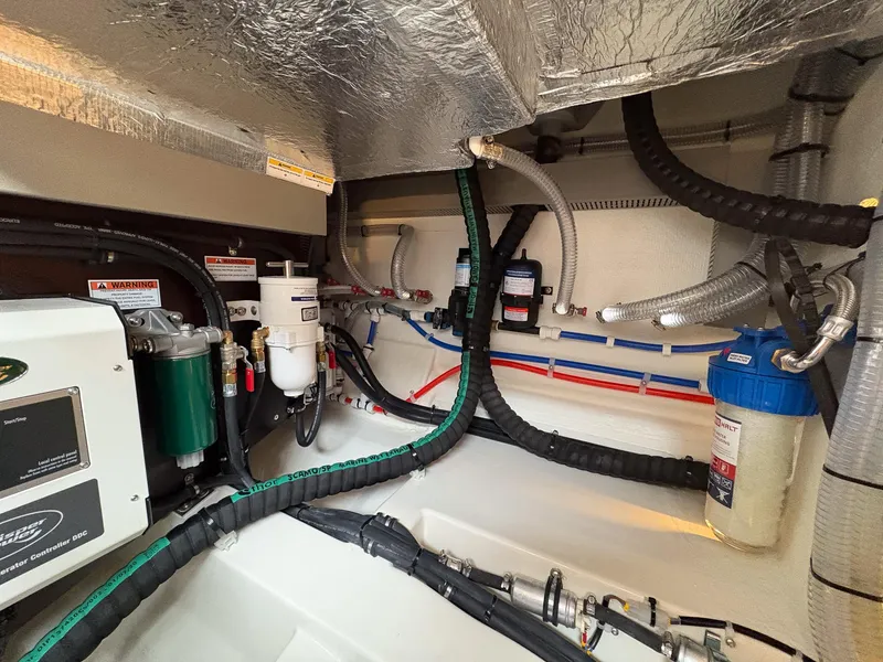 Slide: The Image of Engine room of 2025 Marex 330 Scandinavia, showcasing complex piping and filtration systems. - 48