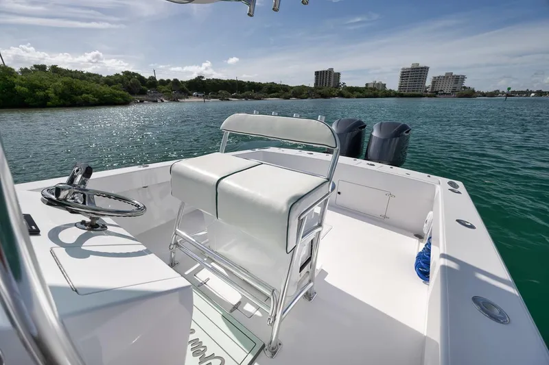 Slide: The Image of 1995 Jupiter 31 Center Console boat with dual engines on a sunny day. - 15