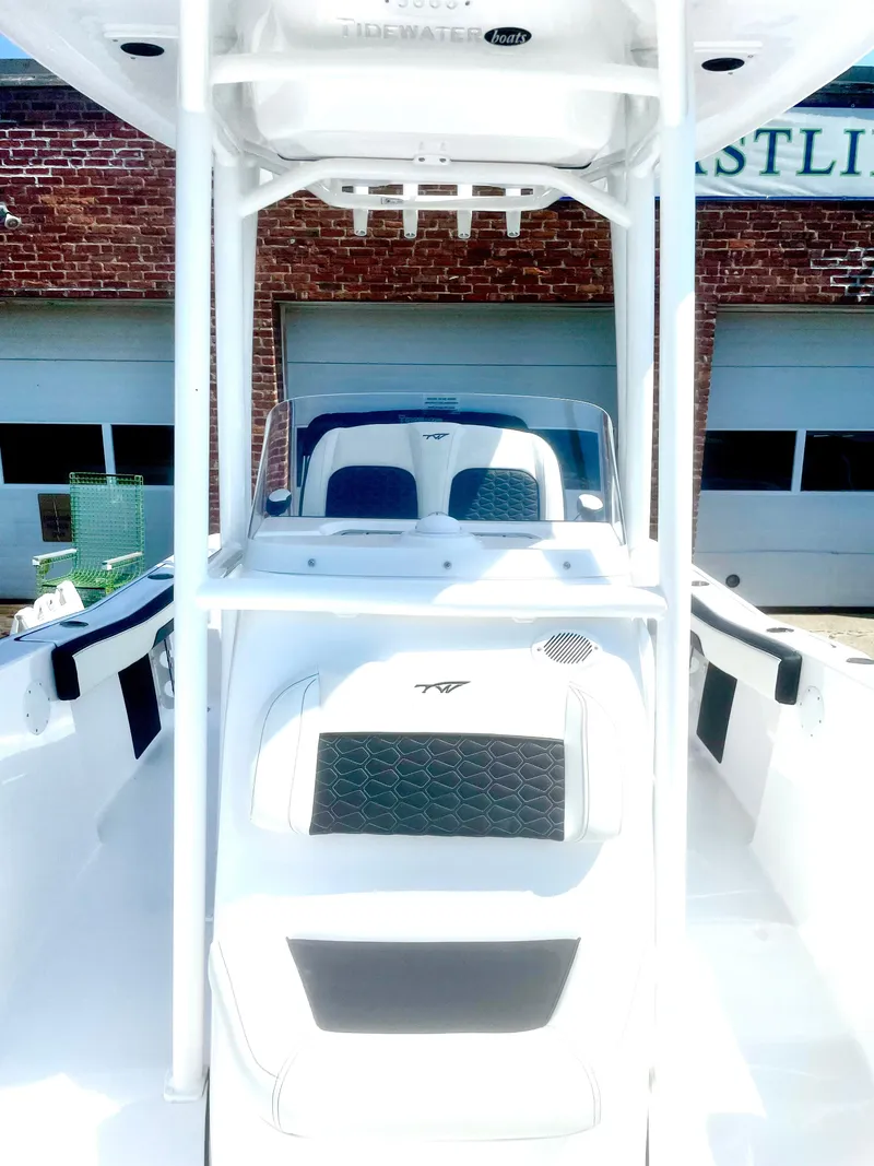 Slide: The Image of 2025 Tidewater 220LXF boat with sleek design, white interior, and modern features. - 4