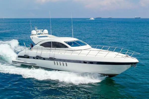 The Image of Mangusta 72 Open 2001 yacht cruising on blue ocean waters. - 0