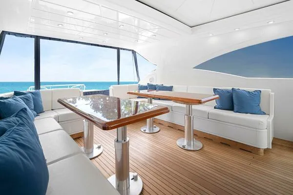 Slide: The Image of Luxurious interior of 2001 Mangusta 72 Open yacht with ocean view and elegant seating. - 11