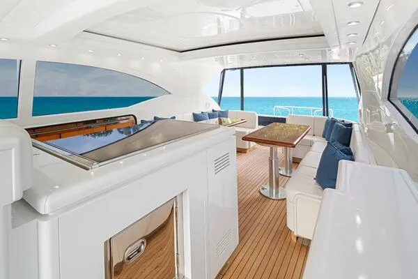 Slide: The Image of Luxurious interior of 2001 Mangusta 72 Open yacht with ocean view and elegant seating. - 15
