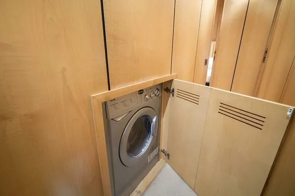 Slide: The Image of Built-in washing machine in 2001 Mangusta 72 Open yacht's wooden cabinet. - 31