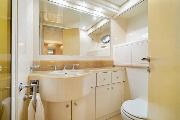 Slide: The Image of Luxurious bathroom interior of 2001 Mangusta 72 Open yacht, featuring modern fixtures and elegant design. - 33