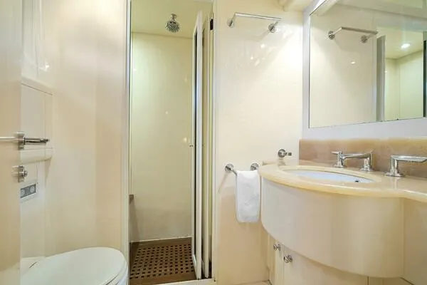 Slide: The Image of Luxurious bathroom in 2001 Mangusta 72 Open yacht, featuring modern fixtures and shower. - 34