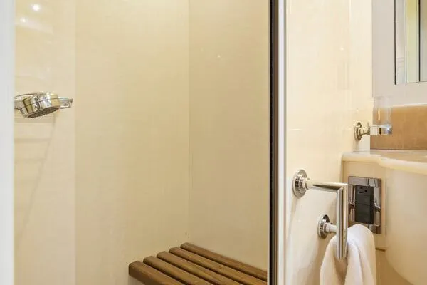 Slide: The Image of Shower area in 2001 Mangusta 72 Open yacht with wooden bench. - 37