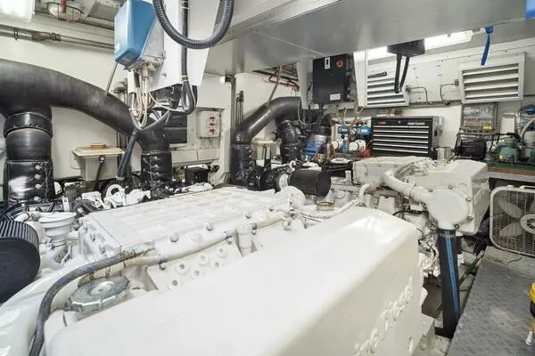 Slide: The Image of Engine room of 2001 Mangusta 72 Open yacht, featuring complex machinery and equipment. - 40