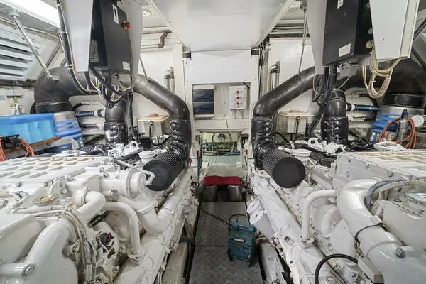 Slide: The Image of Engine room of 2001 Mangusta 72 Open yacht, showcasing dual engines and mechanical systems. - 41