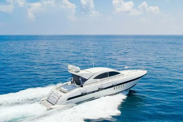 Slide: The Image of Mangusta 72 Open 2001 yacht cruising on open sea under clear skies. - 44