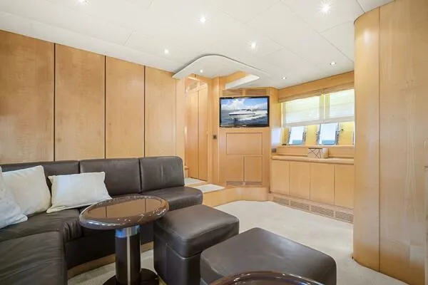 Slide: The Image of Luxurious interior of 2001 Mangusta 72 Open yacht with modern furnishings and wood paneling. - 21