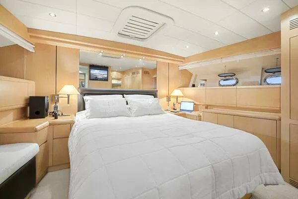 Slide: The Image of Luxurious bedroom interior of 2001 Mangusta 72 Open yacht with modern amenities. - 28