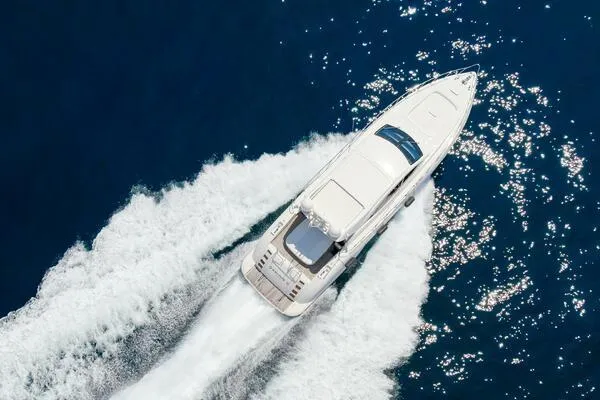Slide: The Image of Mangusta 72 Open 2001 yacht cruising on blue ocean waters, aerial view. - 45