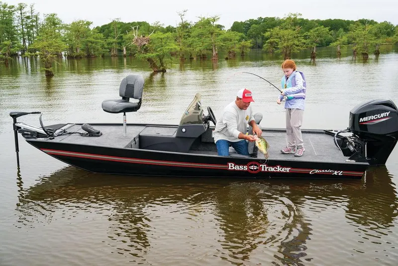 The Image of 2024 Tracker BASS TRACKER® Classic XL boat on a lake with two people fishing. - 0