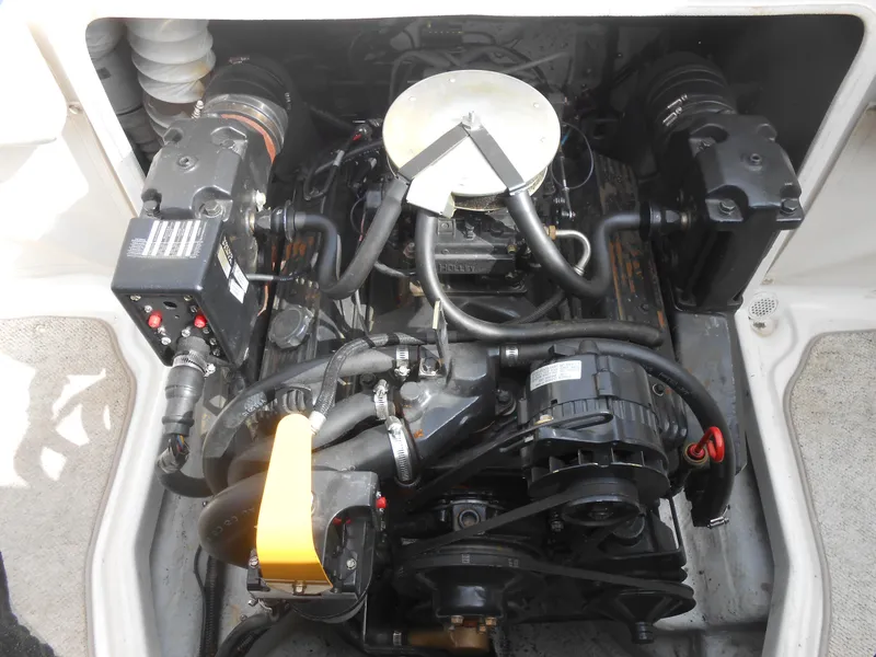 Slide: The Image of Engine compartment of a 2000 Chris-Craft 200 Bowrider SS boat, showcasing mechanical components. - 11