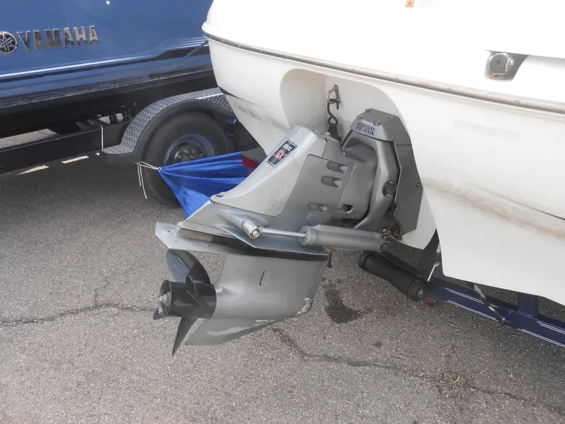 Slide: The Image of Chris-Craft 200 Bowrider SS 2000 boat with visible outboard motor on trailer. - 12