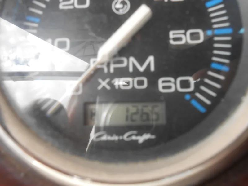 Slide: The Image of Close-up of a Chris-Craft 200 Bowrider SS tachometer showing 126.5 hours. - 5