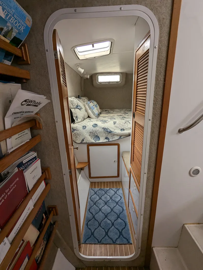 Slide: The Image of Interior of 2000 Manta 42 sailboat with cozy cabin and nautical decor. - 23