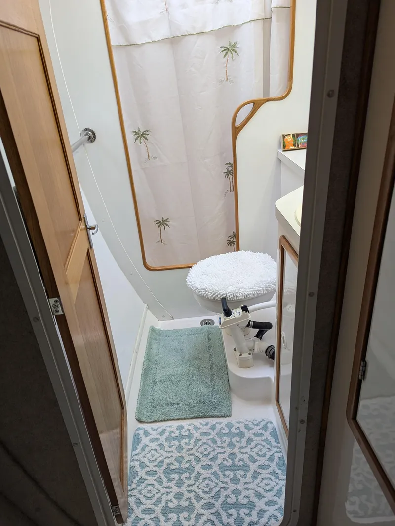 Slide: The Image of Compact bathroom in 2000 Manta 42 boat with shower and toilet. - 33