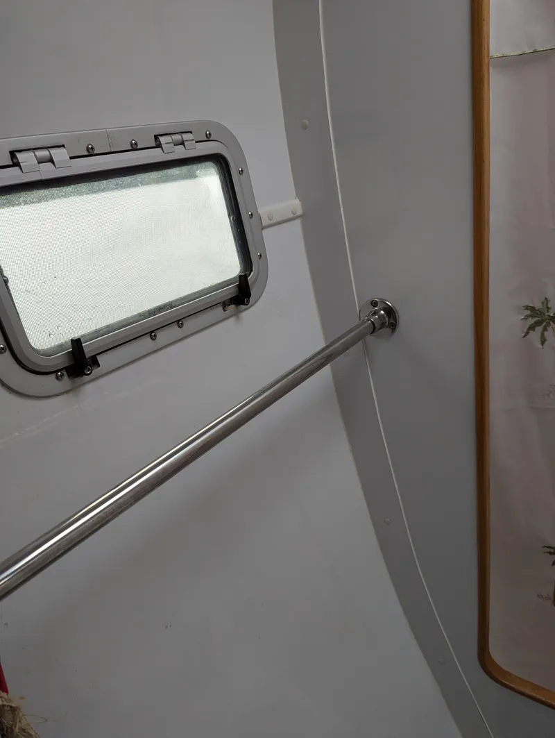 Slide: The Image of Interior of 2000 Manta 42 boat with window and metal handrail. - 35