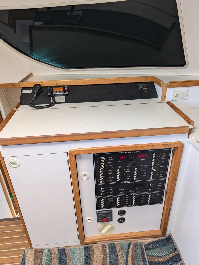 Slide: The Image of Interior view of a 2000 Manta 42 yacht's control panel and communication equipment. - 49